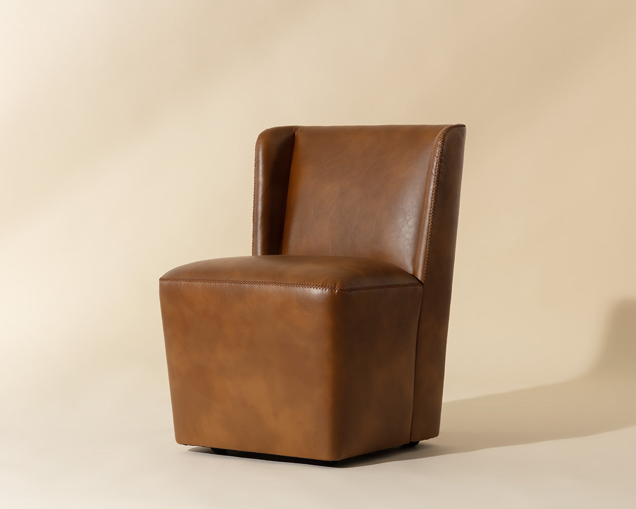 Amita Wheeled Dining Chair - Tobacco Tan